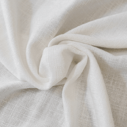 Close-up of softly gathered Helen warm ivory linen-look fabric showing its flexible folds