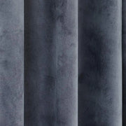 Close-up of charcoal grey velvet curtain fabric showing its soft sheen and flowing folds