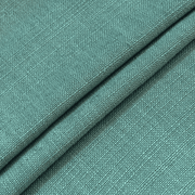 Close-up of  Dusty Teal linen-look curtain fabric showing its textured weave