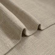 Close-up of oatmeal linen-look curtain fabric showing its textured weave and natural folds