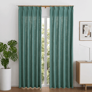 dusty teal linen-look room darkening curtains framing a tall arched window in a modern living room