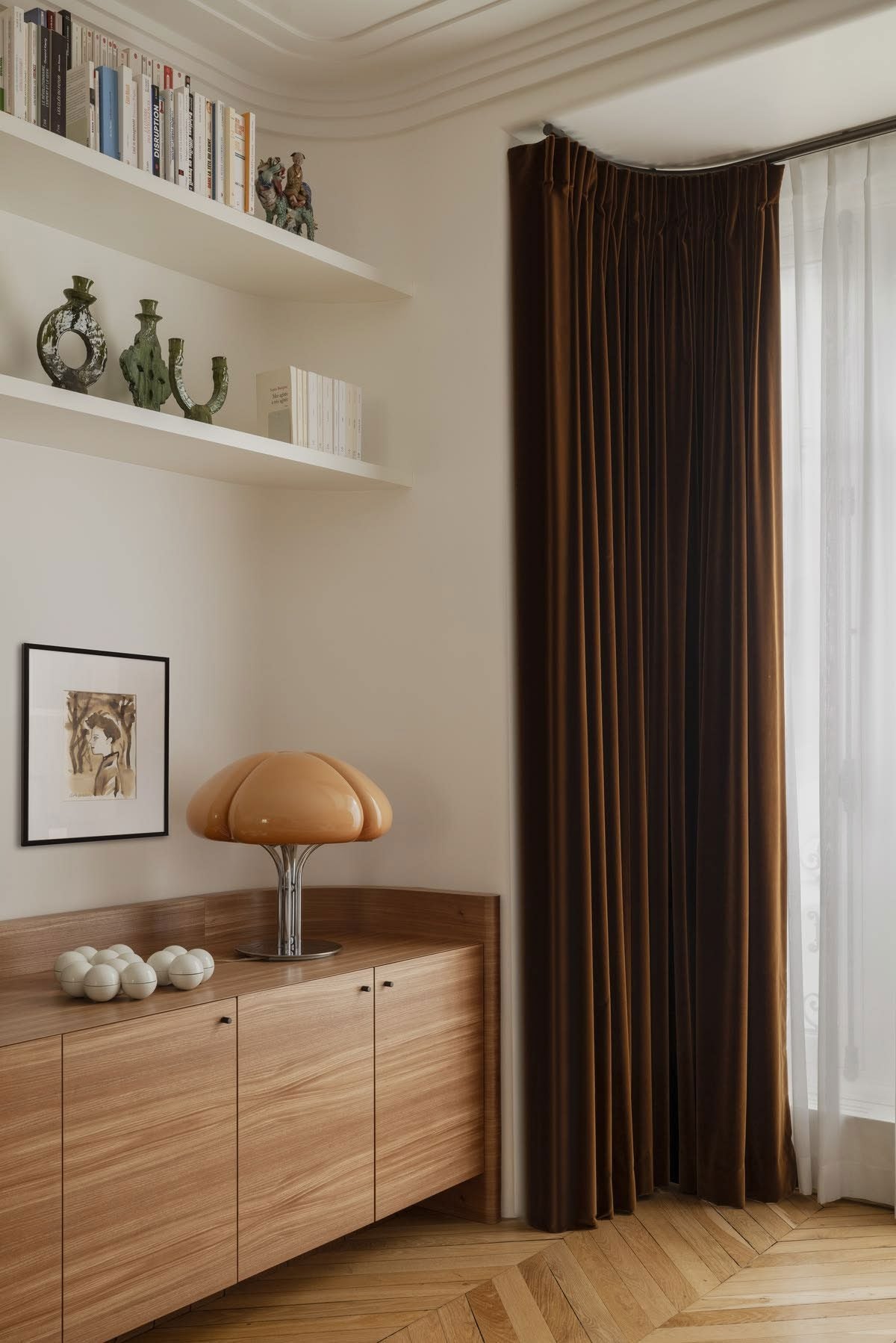 Curtains next to a window and wooden cabinet